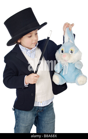 Adorable child dress of illusionist with hat a over white background Stock Photo