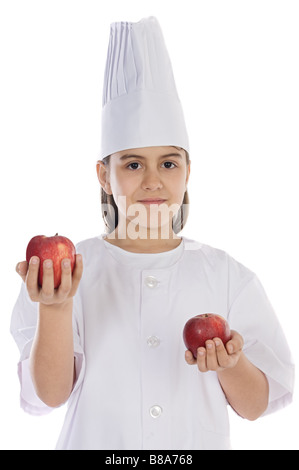 Adorable cook girl with apples on her hands isolated Stock Photo