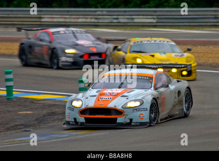 Two Aston Martin DBR9's and a Ferrari 430 GT2 racing in the 2008 Le Mans 24-Hour race, France. Stock Photo