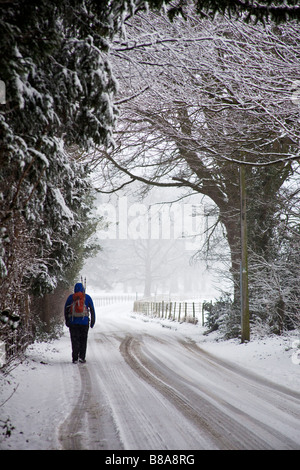 Walking in snow storm Yorkshire England Stock Photo