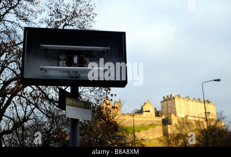 A signpost with Edinburgh Castle in the background Stock Photo