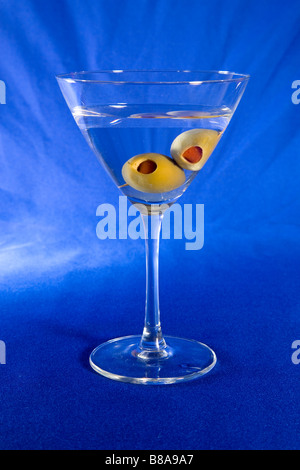 Two spanish olives in a cold dry vodka martini shaken not stirred Stock Photo