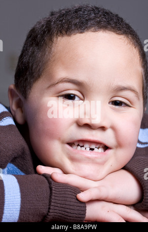 Young boy with missing baby tooth smiling Stock Photo