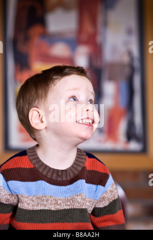 Cute happy boy wearing colorful sweater Stock Photo