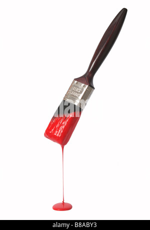 Paintbrush with dripping red paint. Stock Photo