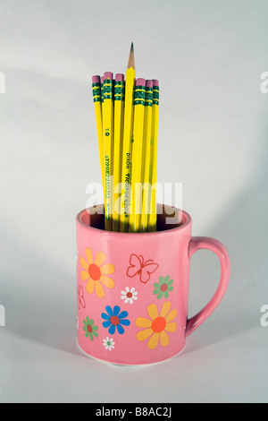 A cup or mug of number 2 Ticonderoga lead or graphite pencils and erasers Stock Photo