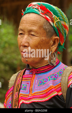 Flower Hmong woman in traditional dress at Coc Ly weekly market, Sapa, Vietnam Stock Photo