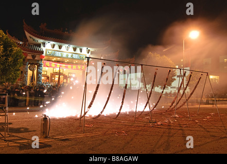 Firecrackers at night during the Chinese New Years Celebration. Stock Photo