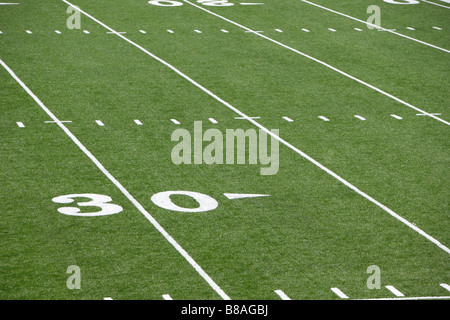 A new astro turf foot ball field Stock Photo