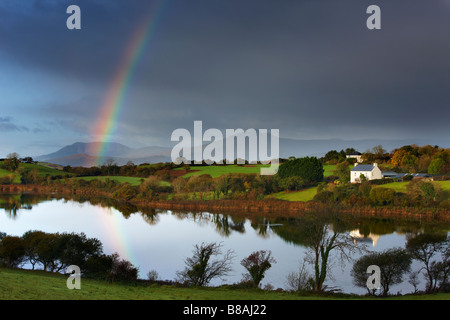 dawn over Bantry Bay, with a rainbow nr Bantry, County Cork, Ireland Stock Photo