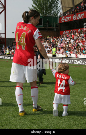 Karen Carney Arsenal Ladies FC holding hand of niece after women’s FA Cup final women's football v Leeds United Ladies FC Stock Photo