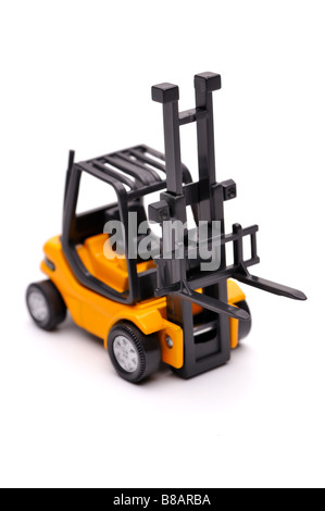 Yellow toy forklift on a white background Stock Photo