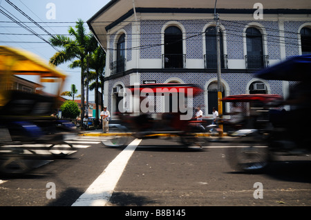 Moto-taxi traffic in Iquitos, Peru. Stock Photo