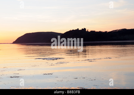 Winter sunset over Towy Estuary towards Llansteffan Castle Carmarthenshire Wales Stock Photo