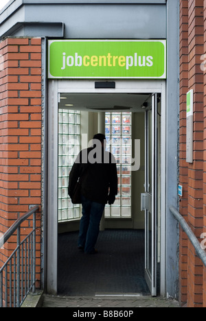 Man walking into the Job centre plus building looking for a job Manchester UK Stock Photo