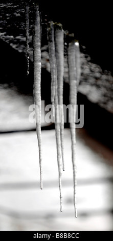 Icicles' hanging from a underneath of a metal road bridge during a cold period of weather. Stock Photo