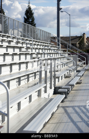 Rows of bleachers line a football stadium Stock Photo