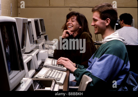 Male and female college students in computer lab Stock Photo