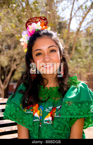 Young Hispanic girl in traditional costume at San Antonio Texas Founders Day Celebration in San Fernando Cathedral Plaza Stock Photo