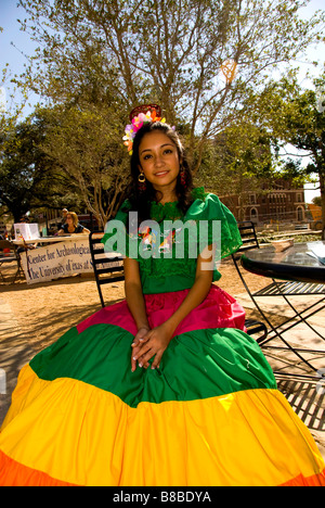 Young Hispanic girl in traditional costume at San Antonio Texas Founders Day Celebration in San Fernando Cathedral Plaza Stock Photo