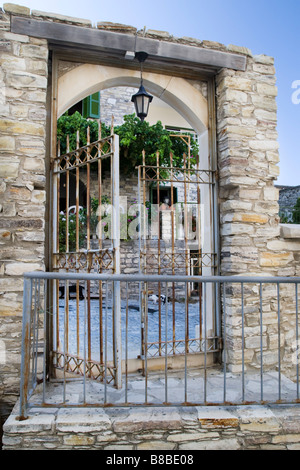 Forged metal gate entrance to the yard of church Panagia Eleousa (Blessed Virgin Mary the Merciful) Upper Lefkara, South Cyprus Stock Photo