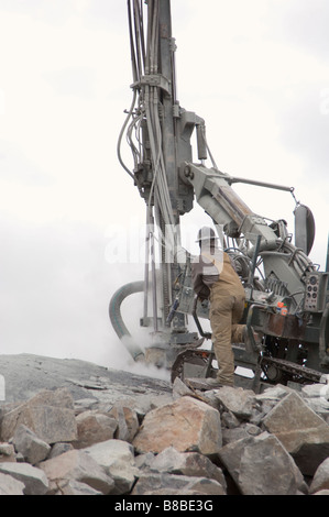 Construction Worker Blasting to make new Subdivision, Yellowknife, Northwest Territories Stock Photo