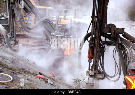 Construction Worker Blasting to make new Subdivision, Yellowknife, Northwest Territories Stock Photo