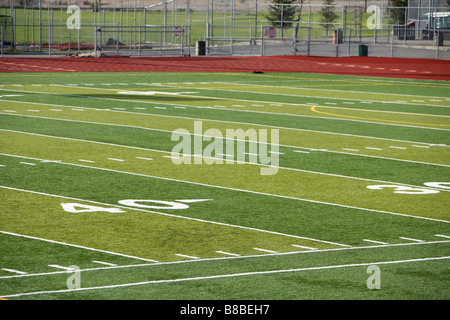 A new astro turf foot ball field Stock Photo