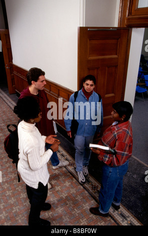 College student talking in school hallway Stock Photo