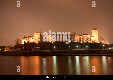 River Wista at night with Wawel castle and hill in background. Krakow, Poland Stock Photo