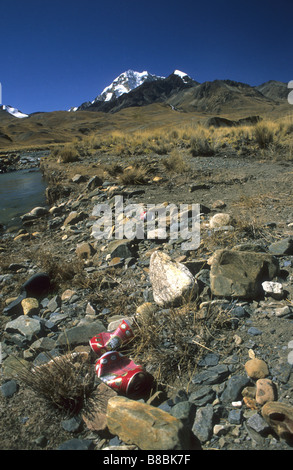 Trash on a hiking trail, Mt Huayna Potosi in background, Cordillera Real, Bolivia Stock Photo