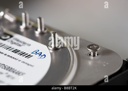multiple hex screws from a hard disk drive that's being repaired Stock Photo
