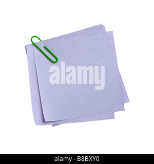 Blue paper note with green clinch It is attached red pin on a white background Stock Photo