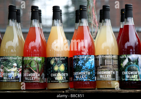 Bottles of fruit juice in London Farmers Market Stock Photo