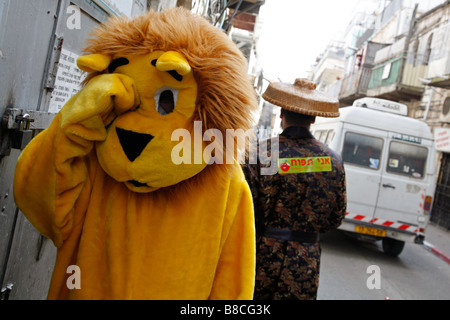 An Israeli Jew dressed as a lion to celebrate Purim, a Jewish religious festival in Jerusalem. Stock Photo