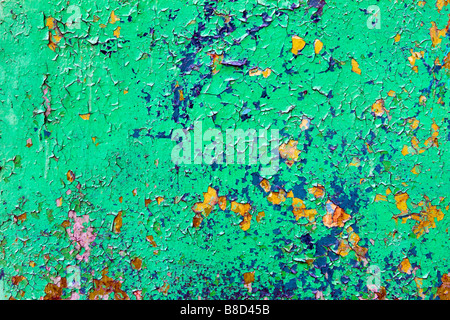 Closeup of green metal sheet with peeling off paint. Stock Photo