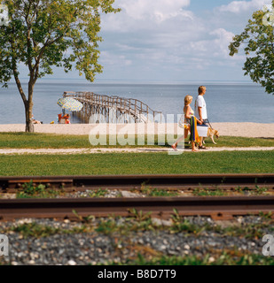 Couple Walking along Beach, Lake Winnipeg, Manitoba Stock Photo