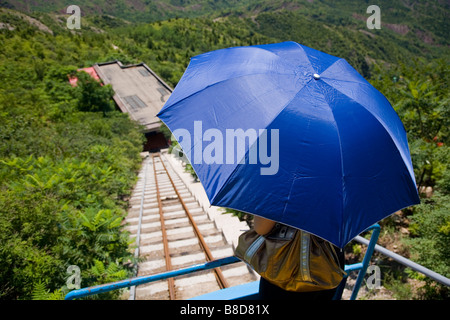 A tourist descends lift from  Simatai Great Wall 5 4 km section   Great Wall  China located  north  Miyun county, China Stock Photo