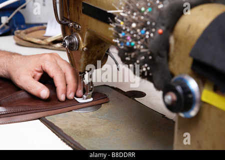 Shoemaker Repairing Boot in Shoe Shop Stock Photo