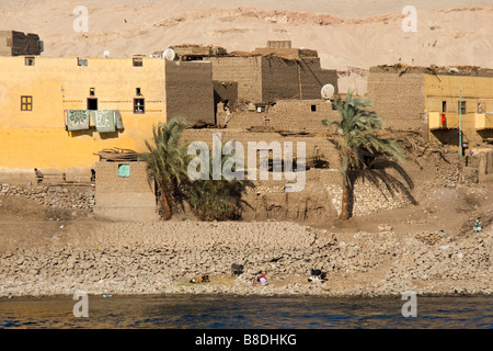 Traditional mud houses on bank of River Nile Stock Photo