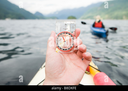 Kayaker with compass Stock Photo