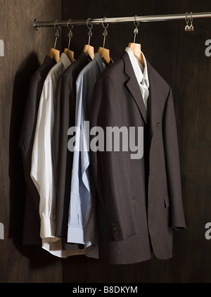 Suits hanging in a closet Stock Photo