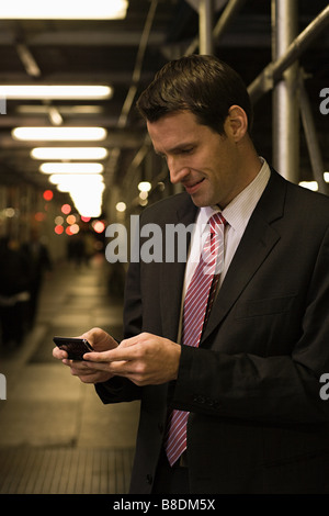 Businessman text messaging Stock Photo