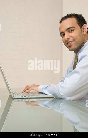 Office worker using laptop Stock Photo