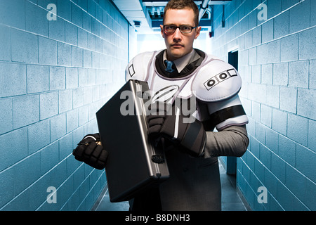 Businessman wearing ice hockey pads Stock Photo