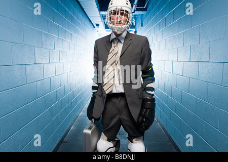 Businessman wearing an ice hockey helmet Stock Photo