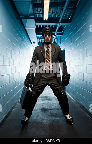 Businessman wearing ice hockey uniform Stock Photo