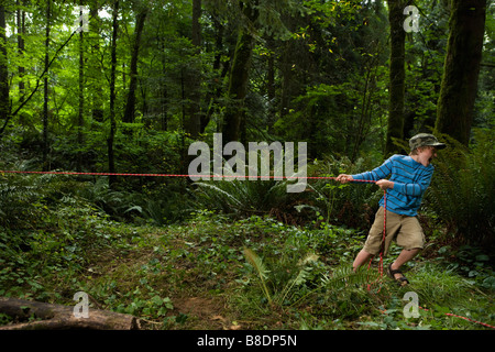 Boy pulling rope Stock Photo