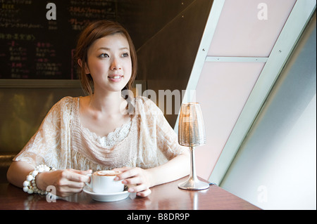 Young woman having coffee Stock Photo