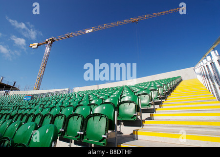 Rows of empty seats at Somerset cricket club taunton england with construction going on in the background Stock Photo